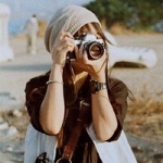 唯美拿着相机的女头图片